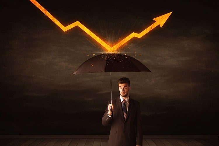 How to Keep Drawdown in Forex Under Control 1 Man with umbrella holding up orange arrow