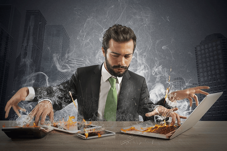 Are You Overtrading? Here's How to Stop 1 Man overtrading at computer desk