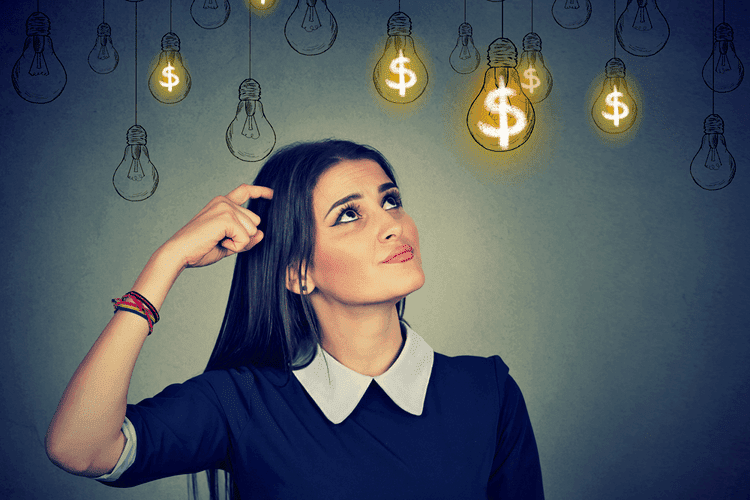 How Many Trading Strategies Do You Need to Succeed? 1 Woman thinking and staring at light bulbs